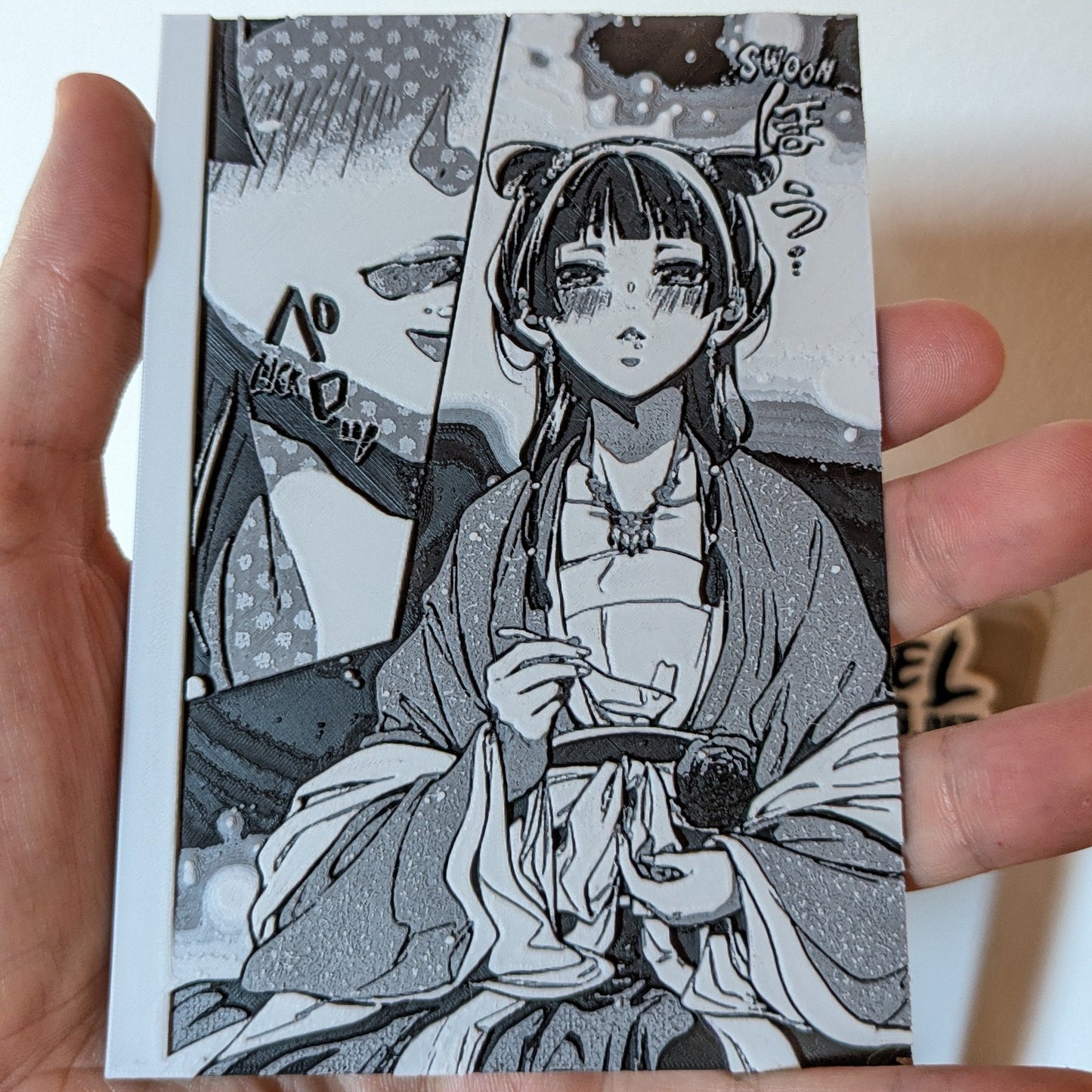 Close-up detail of Maomao character magnet from The Apothecary Diaries anime