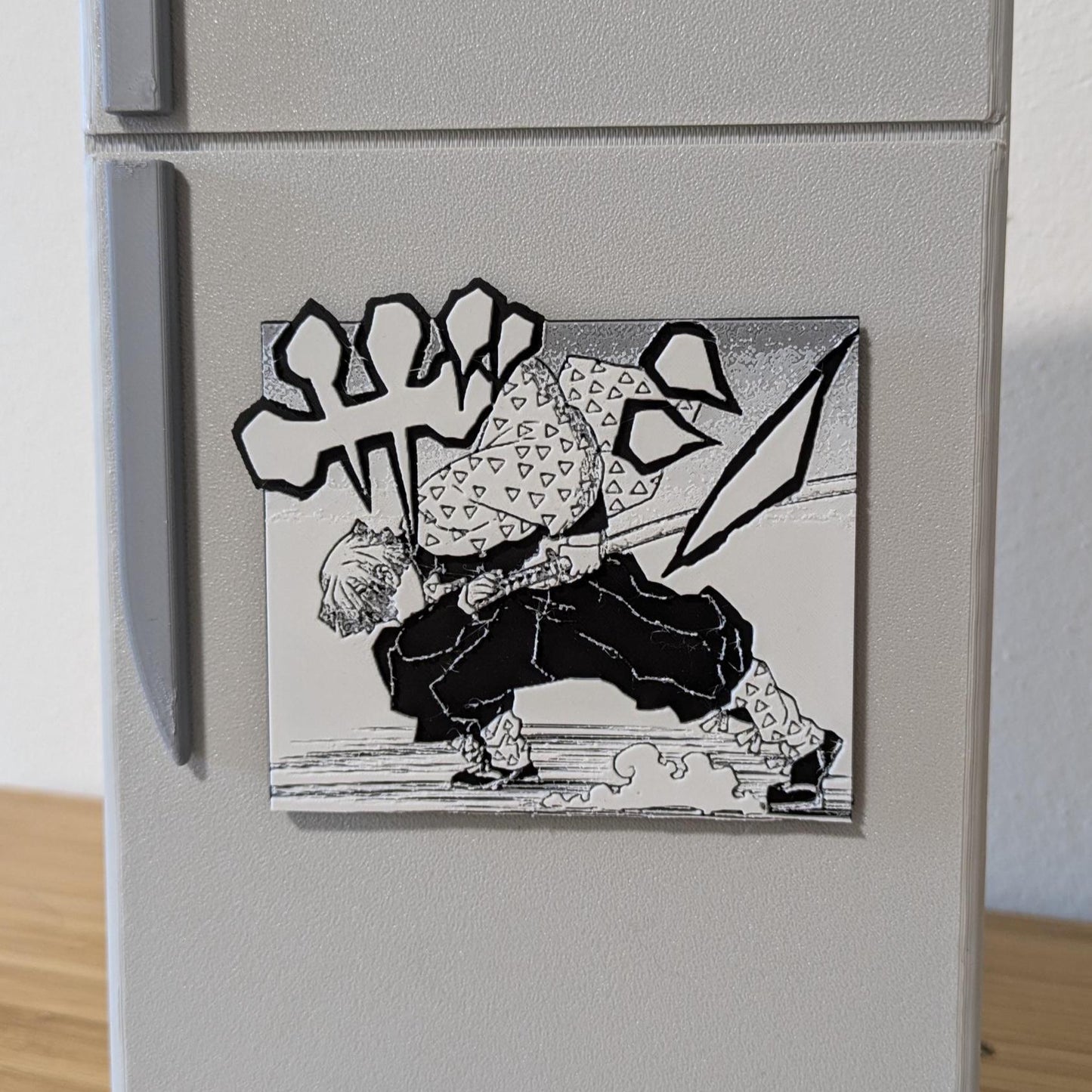 Side angle view of Demon Slayer Zenitsu magnet displaying 3D depth and action pose design