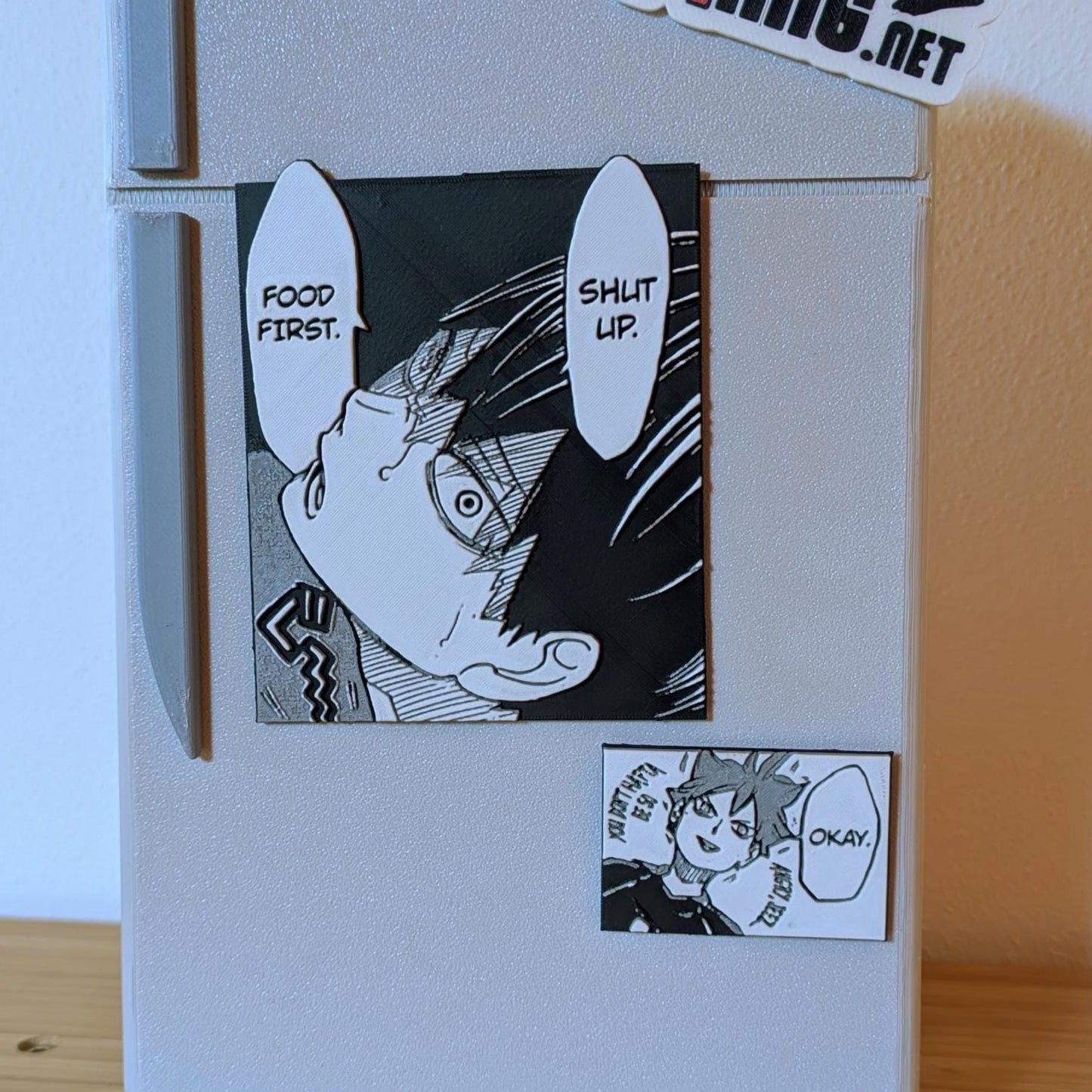 Haikyuu!! magnet set showing main 7x9cm (2.8x3.5in) Tsukishima panel and bonus mini magnet side by side