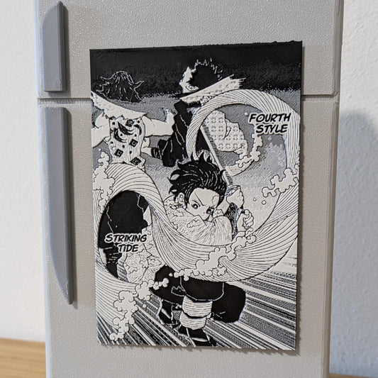 Close-up of handcrafted Demon Slayer Tanjiro magnet highlighting high-definition manga artwork and water breathing details