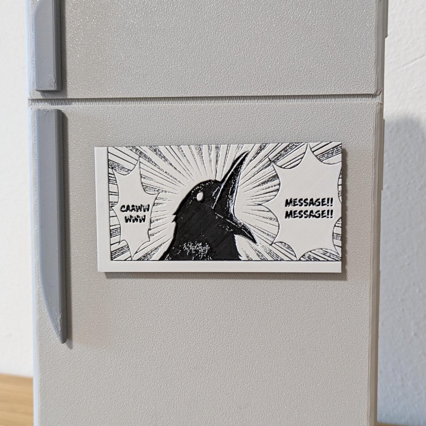 Close-up view of handcrafted Demon Slayer crow magnet with high-definition textures and intricate details
