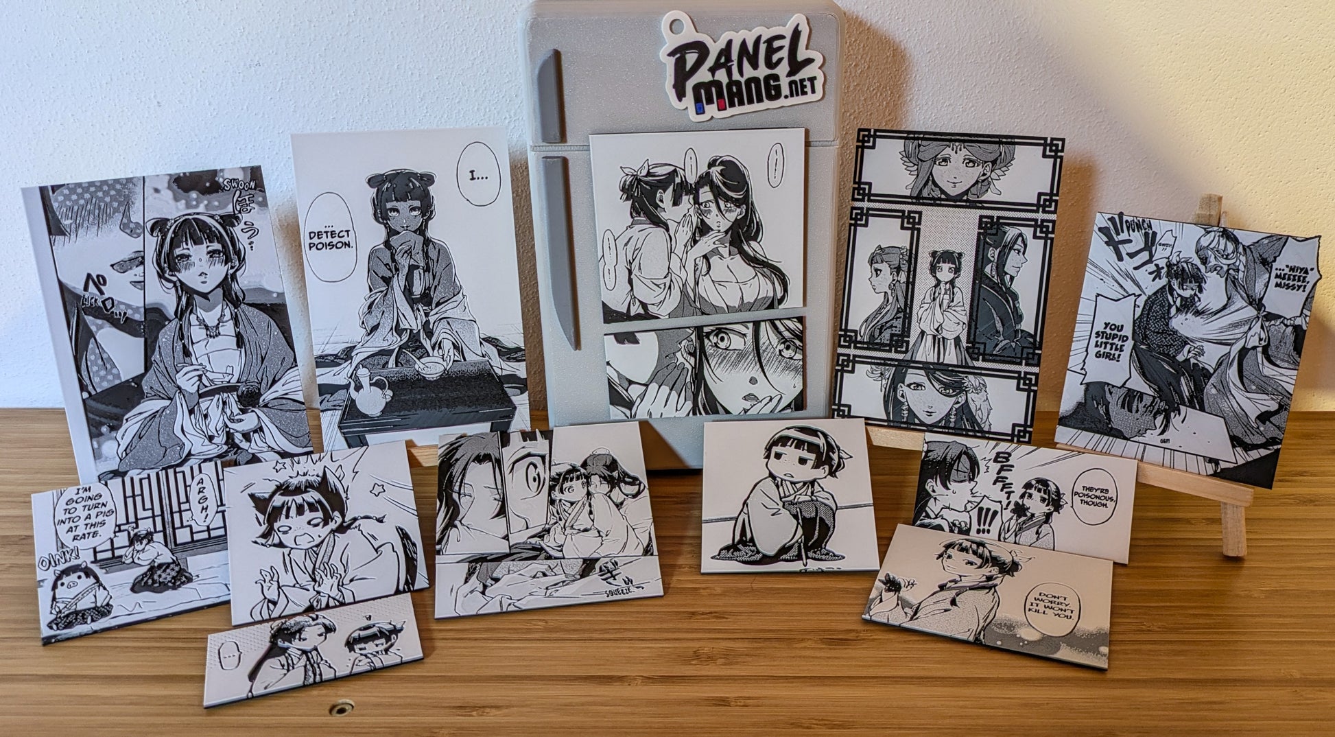 Size comparison of Apothecary Diaries magnet panel with hand or common object showing dimensions for manga collectors and gift buyers